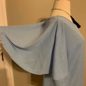 This light Blue Top/Blouse is very Fun in many ways. I just love the Back